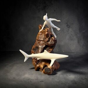 Vintage John Perry  sculpture featuring a shark and a diver On Burl Wood